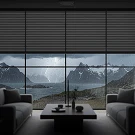 Modern living room with mountain and lake view through large windows