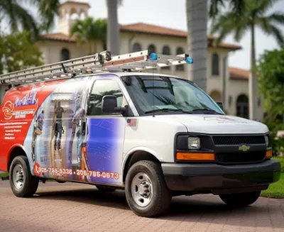 HVAC service van parked at upscale tropical residence.