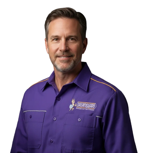 Portrait of technician in purple SERVPRO shirt with orange piping, posed against white background for brand identity.